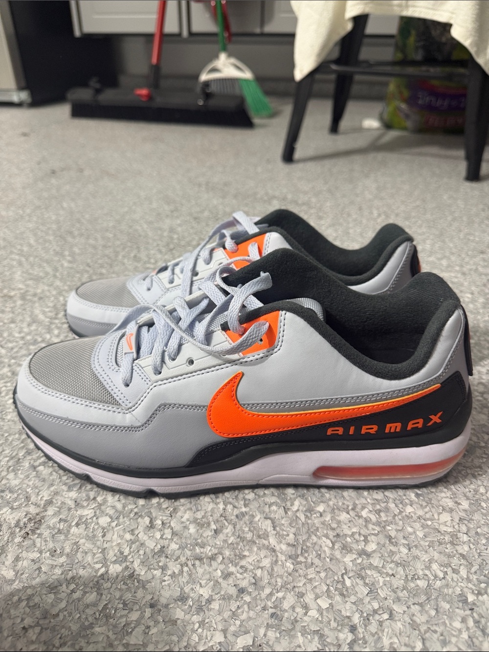 Nike Gray Sneakers with Bright Orange Swoosh